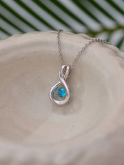 Infinity Design Blue Topaz Dancing Pendant In Pure Silver